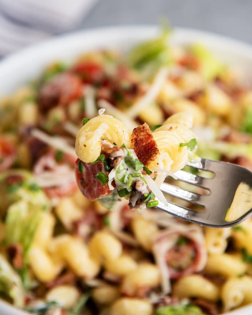 A forkful of BLT pasta salad.