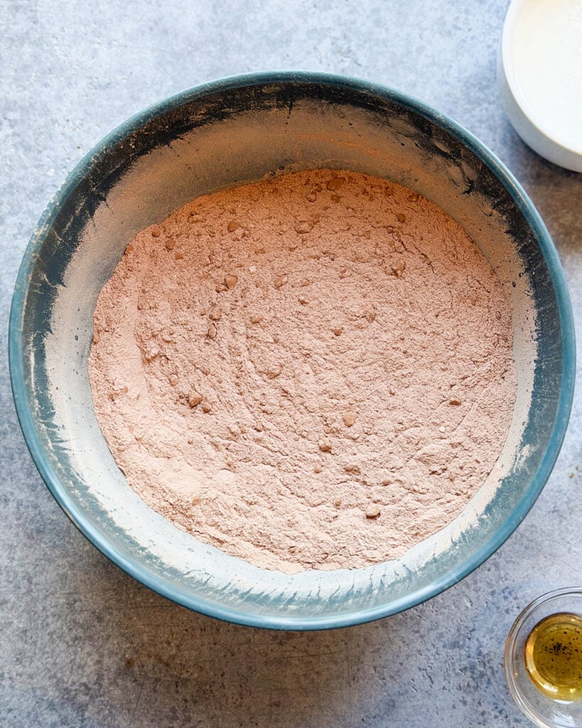 Cocoa powder and flour whisked together in a bowl. 