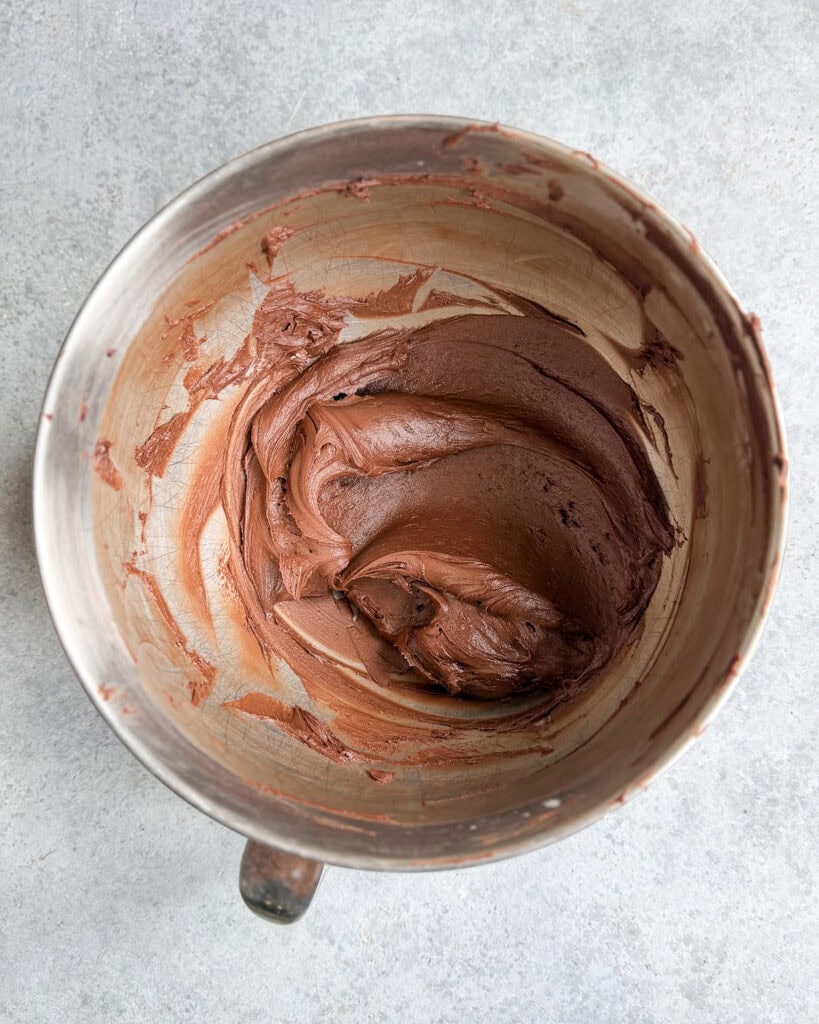Chocolate Buttercream frosting in a metal bowl. 