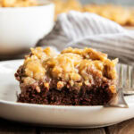 A piece of German Chocolate Texas sheet Cake on a plate.
