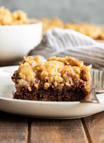 A piece of German Chocolate Texas sheet Cake on a plate.