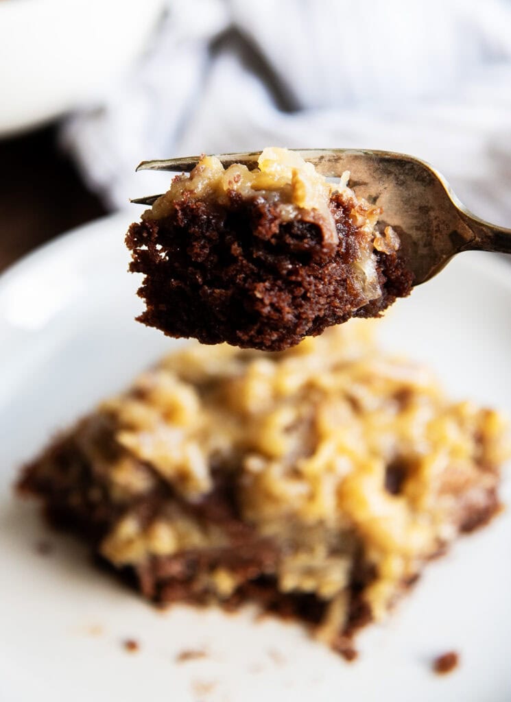 A bite of German Chocolate Sheet Cake on a fork.
