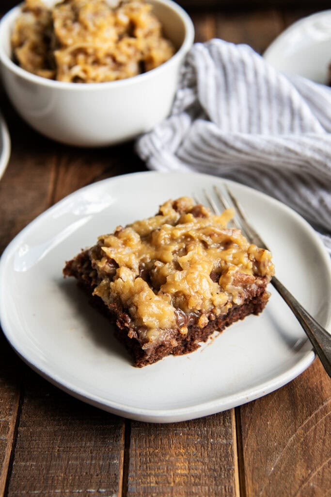 A piece of German Chocolate Texas sheet Cake on a plate.
