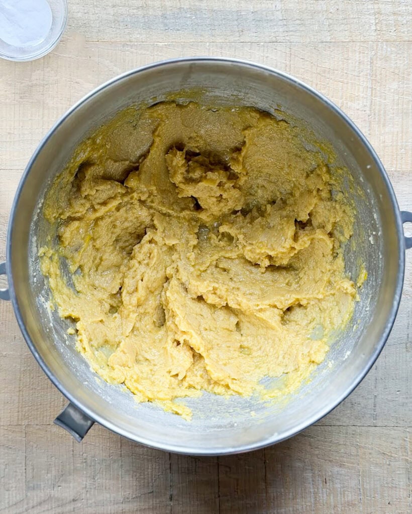 Creamed butter and sugar in a metal stand mixer bowl.