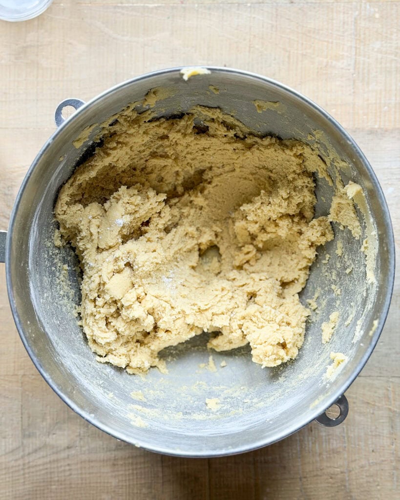 Cookie dough in a stand mixer bowl.