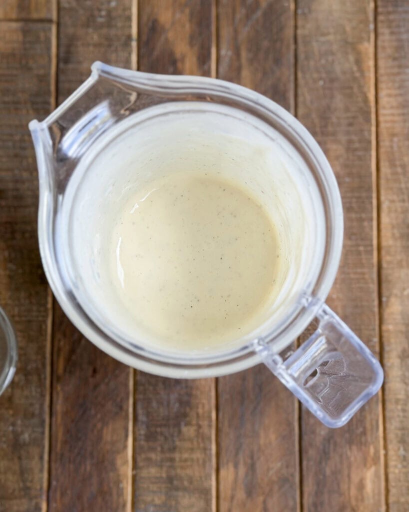 A small blender of poppy seed dressing.