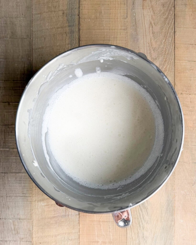 Cream cheese ice cream base in a metal bowl.