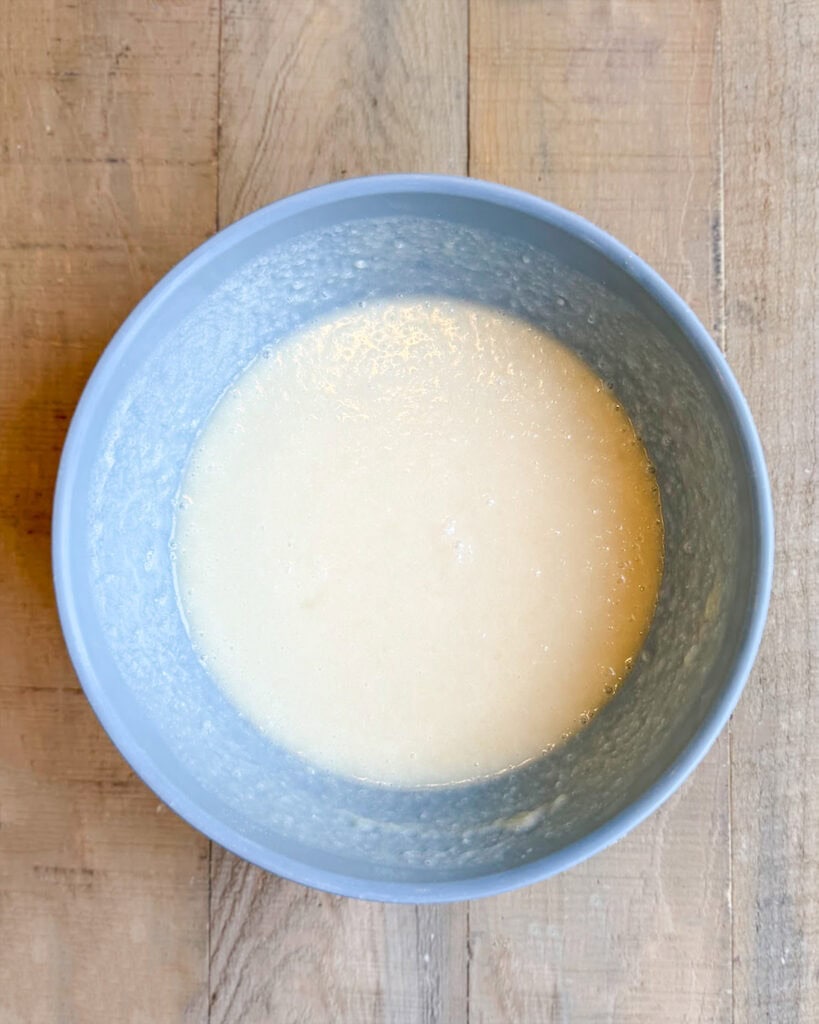Cobbler batter in a small blue bowl.