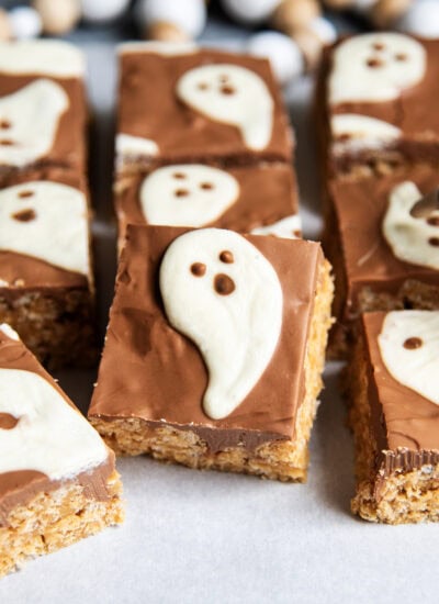A scotcheroo topped with chocolate and a white chocolate ghost.